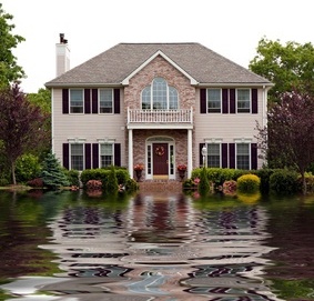 House with flood damage concept with water reflections.